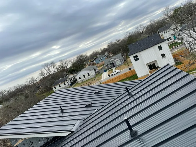 Standing seam metal roof panels with vents for Skylight Repair in Crystal Lake